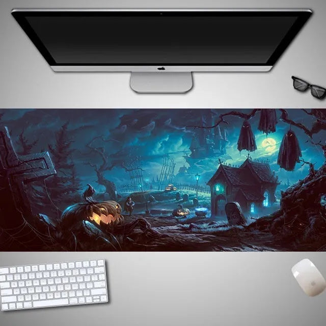 Oversized black mouse pad with Halloween-themed graphic, shown on a wooden desk with keyboard and gaming mouse.