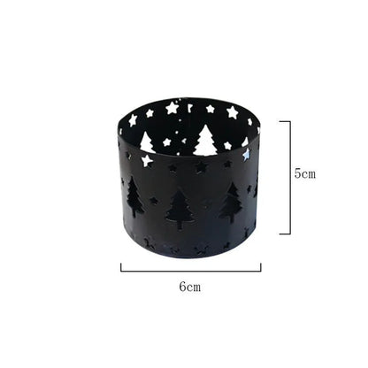 Black iron Christmas candlestick holder with elk bracket design and Santa Claus motifs