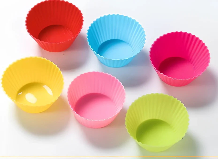 Six different coloured silicone cupcake liners showing fluted edges and nonstick surface
