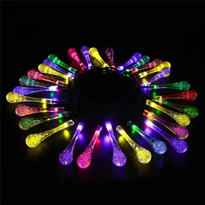 LED outdoor water drops solar string lights with bubble drop pendants on 6.5m cable, solar panel and ground spike included