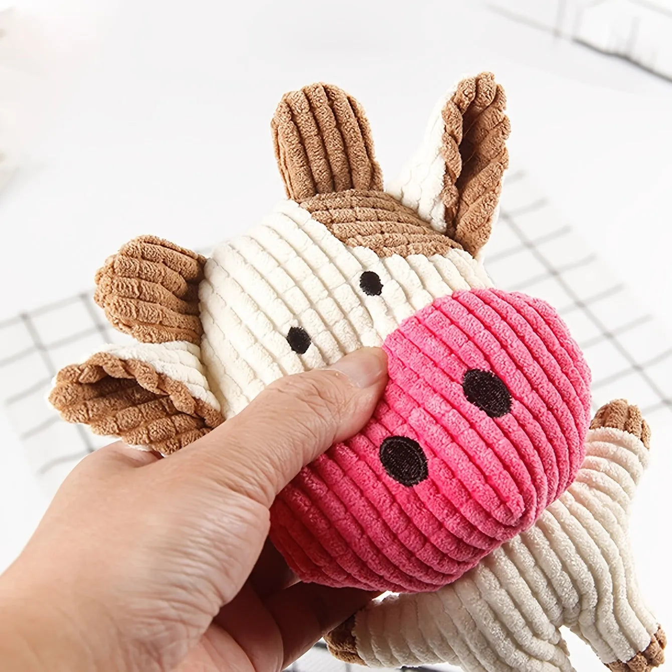 Animal shaped plush dog chew toy with squeaker in bright colours