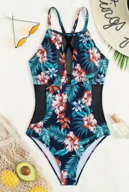 Women's deep V-neck one-piece swimsuit with a printed pattern in a solid colour.