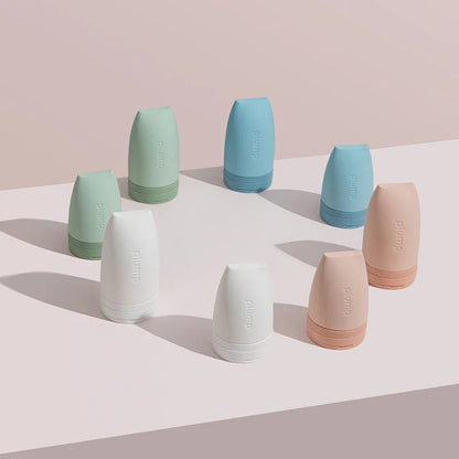 Compact silicone travel bottles for cosmetics, available in multiple vibrant colors and sizes for convenient on-the-go beauty storage and application.