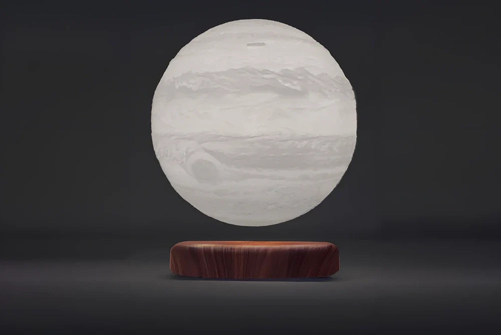 Levitating Earth or Jupiter lamp floating above base with LED illumination
