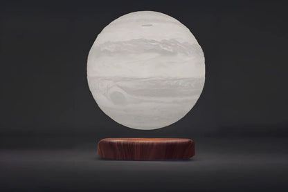 Levitating Earth or Jupiter lamp floating above base with LED illumination