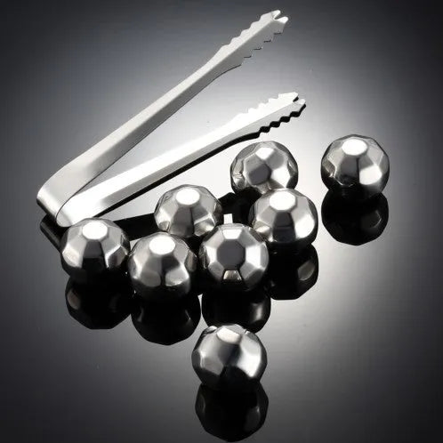 Set of eight stainless steel whiskey cooling stones with metal clip in plastic storage container