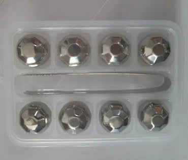 Set of eight stainless steel whiskey cooling stones with metal clip in plastic storage container