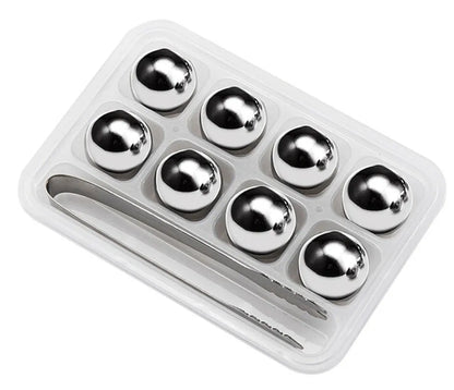 Set of eight stainless steel whiskey cooling stones with metal clip in plastic storage container