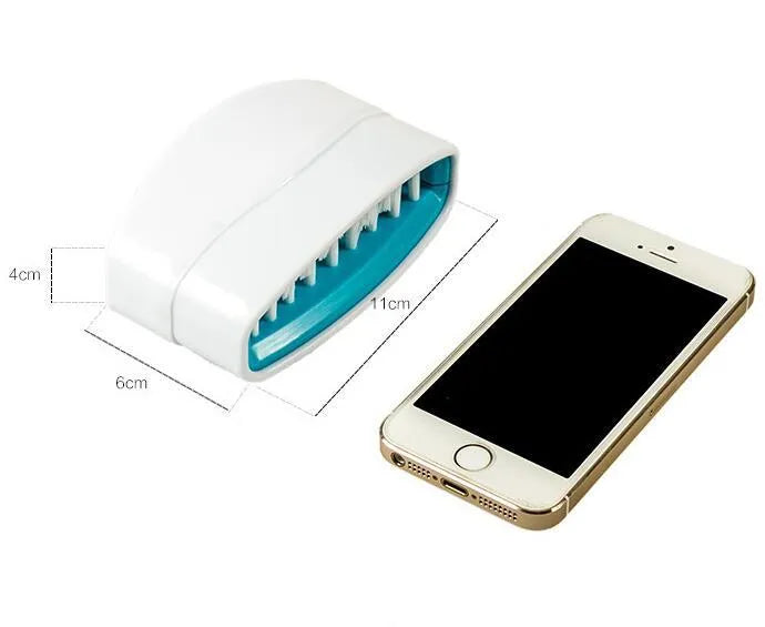 Blue kitchen brush with utensil slots and suction cup for fruit and vegetable cleaning