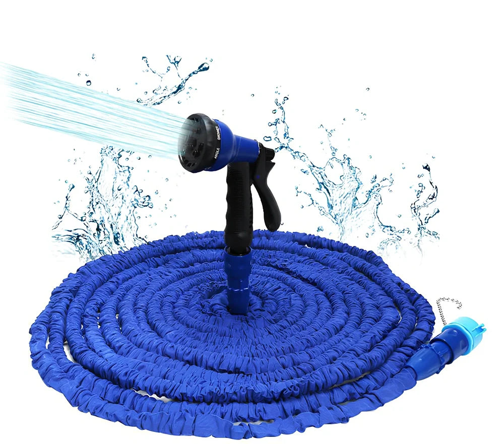 Expandable flexible water hose with spray gun showing green colour and extended length with water spraying in cone pattern