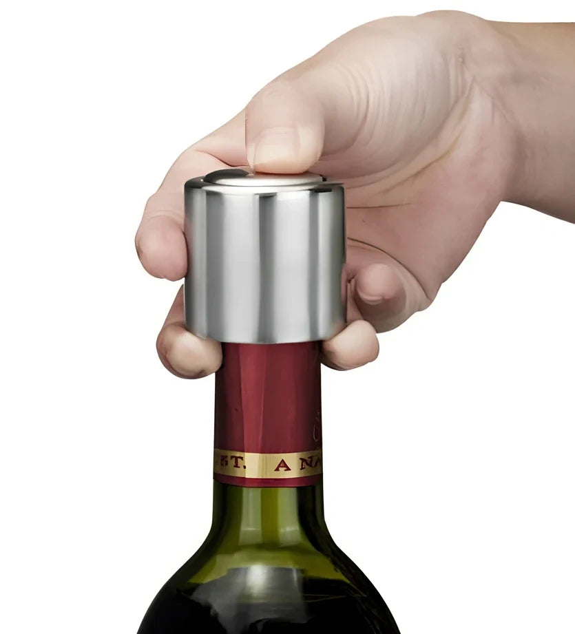 Silver stainless steel vacuum wine stopper, 4.1cm x 5cm x 3.1cm, preserves freshness by removing air from standard bottles