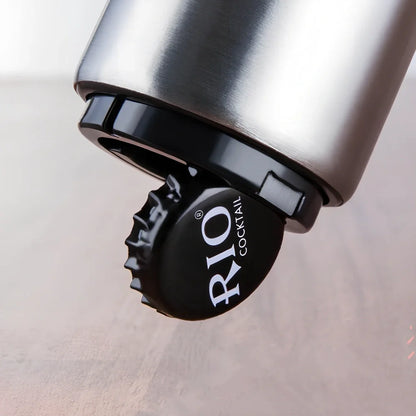 Stainless steel automatic press bottle opener with titanium-plated finish showing press mechanism and textured handle