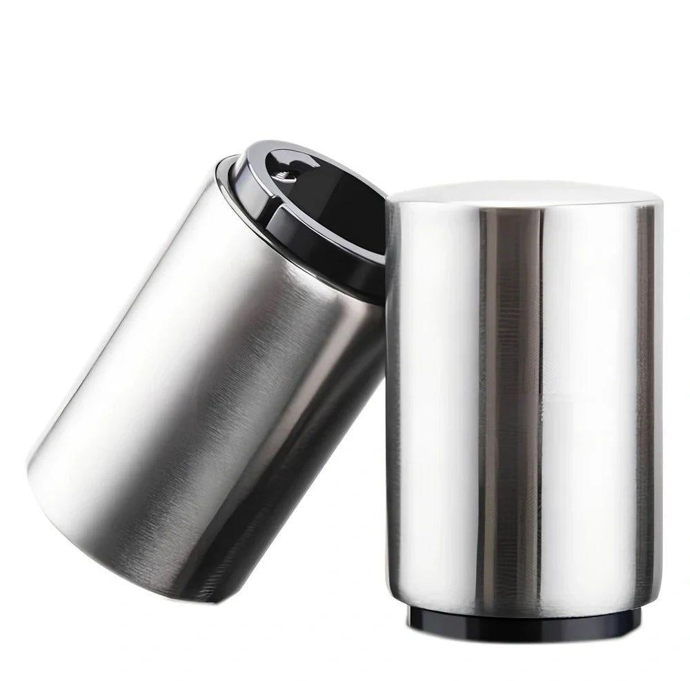 Stainless steel automatic press bottle opener with titanium-plated finish showing press mechanism and textured handle