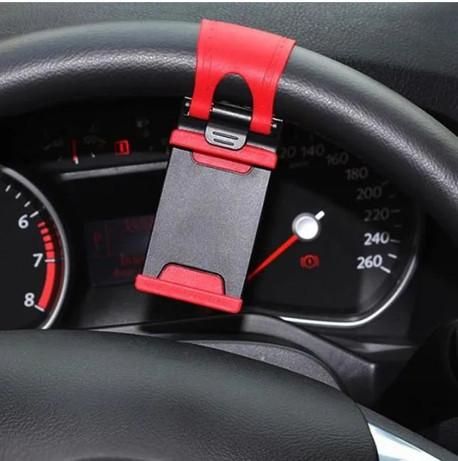 Black steering wheel phone holder with 75mm clip mounted on car wheel holding smartphone