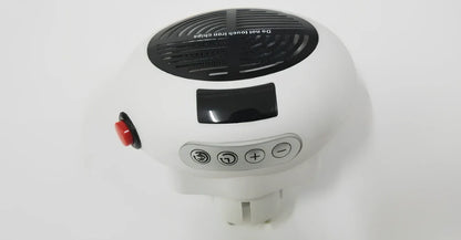 Black portable mini heater with temperature control dial showing 15-32°C range and compact design