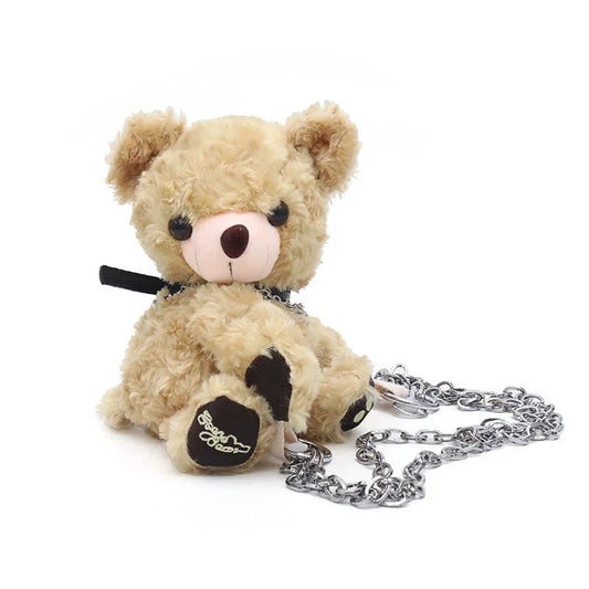 A plush teddy bear crossbody messenger bag with an adjustable shoulder strap and a zippered interior pocket for convenient storage.