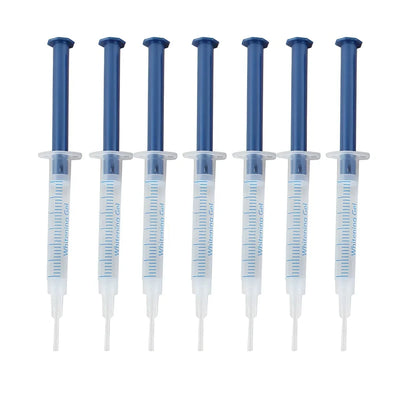 Teeth whitening gel kit with thermoform trays, cold light lamp, 10 gel syringes, and 3D shade guide showing 7-10 improvement