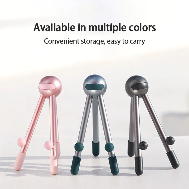 Aluminium alloy desktop phone and tablet stand with 120-degree adjustable angle, alien shape, green and pink options.