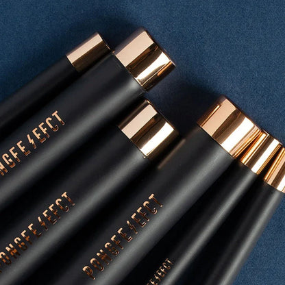 A premium makeup brush set with a sleek black and gold design, featuring 11 essential brushes and a magnetic holder for easy organization.