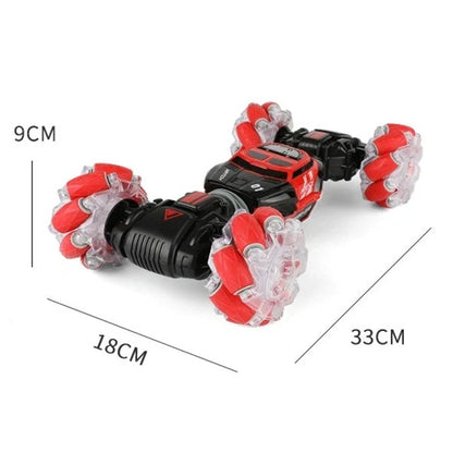 Red 4WD RC stunt car performing sideways drift with LED lights illuminated, showing gesture remote control