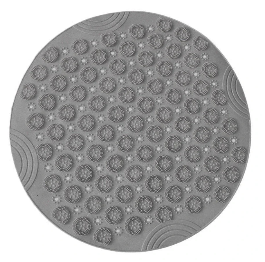 Textured round shower mat with anti-slip surface, massage nodules, and drainage holes for a comfortable and safe bathing experience