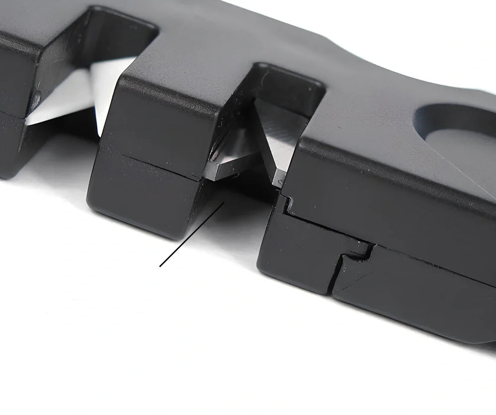 Black Pocket Pal knife sharpener showing carbide blades, ceramic stones, and tapered diamond rod on 3.5-inch compact unit