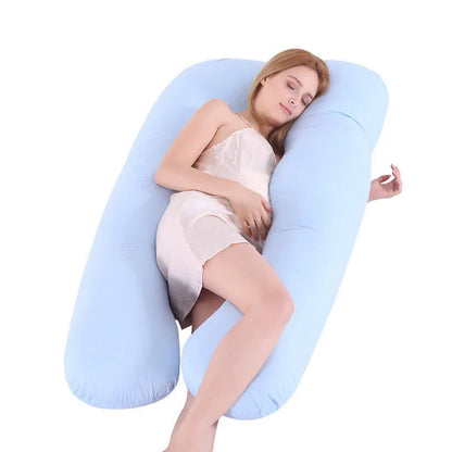 Large U-shaped pregnancy support pillow with removable cover and abdominal support belt.