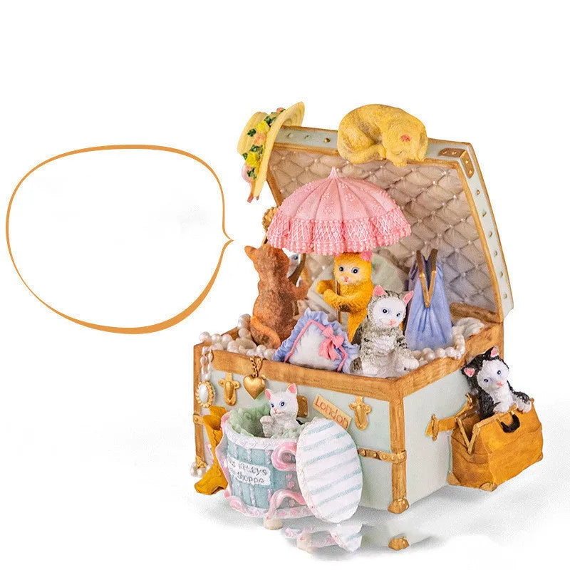 Cold porcelain cat-shaped music box with jewellery storage, rotating snowflake light, and mechanical movement