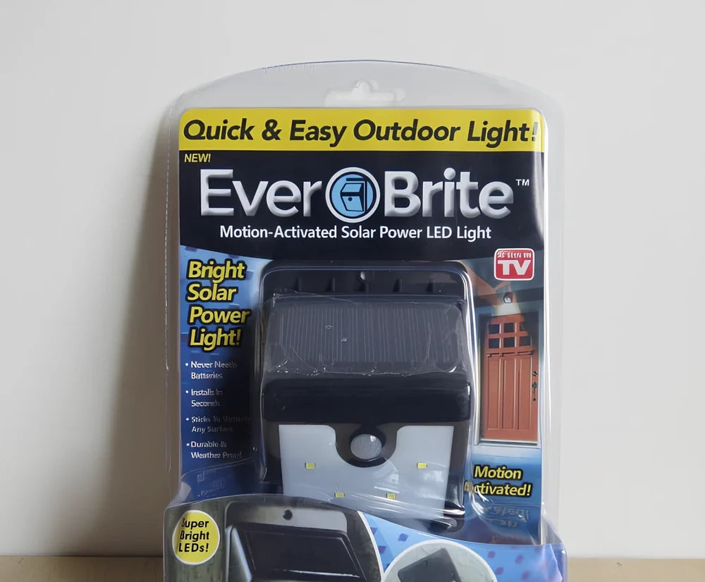 Solar 4 LED sensor lights mounted on garden wall, showing motion detection range and bright illumination at night