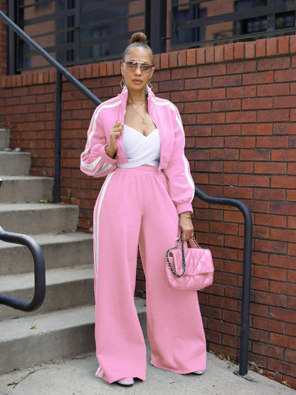 Grey striped streetwear two-piece suit set with zipper detailing on the top and trousers.