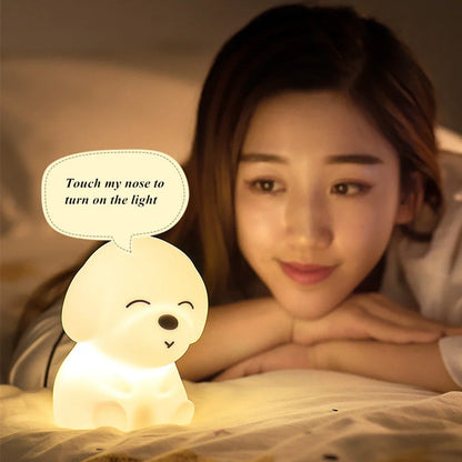 White silicone dog shaped table lamp with touch sensitive nose and colourful LED illumination