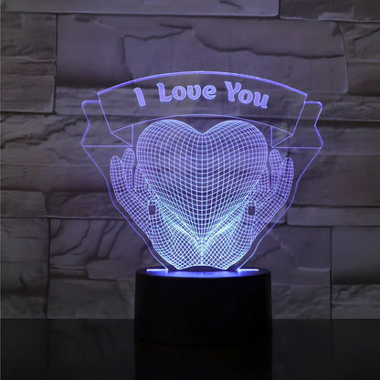 3D acrylic night light with hands holding heart design, showing seven colour options and remote control