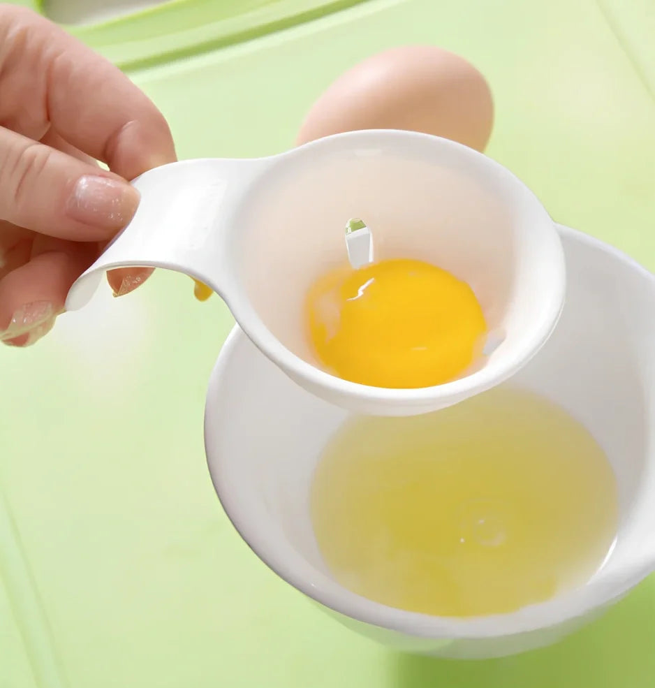 White ABS plastic egg separator with 10cm handle and 7.3cm bowl for yolk separation