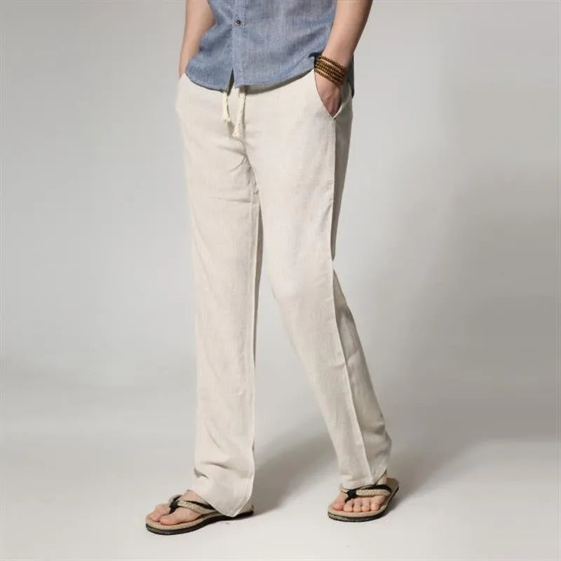 Men's straight leg casual trousers in cotton linen blend fabric showing loose fit and zip fly closure