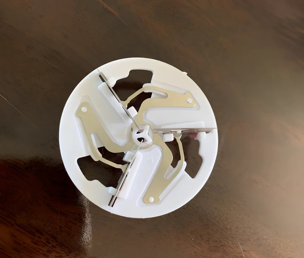 White rechargeable lint remover with detachable head and USB charging cable