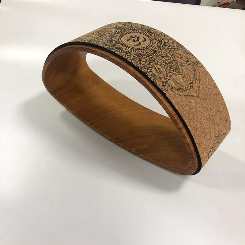 Cork Yoga Wheel Half-round for backbend and core exercises in black and wood grain