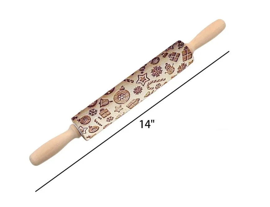Wooden rolling pin with engraved Christmas patterns including reindeer and snowflakes on a 45cm long barrel.