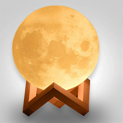 3D printed moon night light with detailed lunar surface and dual-colour LED lighting on beech wood stand