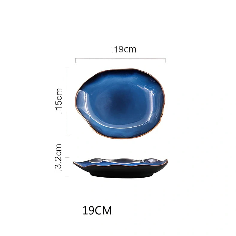 Blue irregular ceramic plate with kiln-changing glaze pattern, measuring approximately 20cm across irregular edges