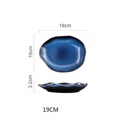 Blue irregular ceramic plate with kiln-changing glaze pattern, measuring approximately 20cm across irregular edges