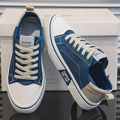 Men's low-top blue canvas skate shoes with round toe and flat heel on a white background.