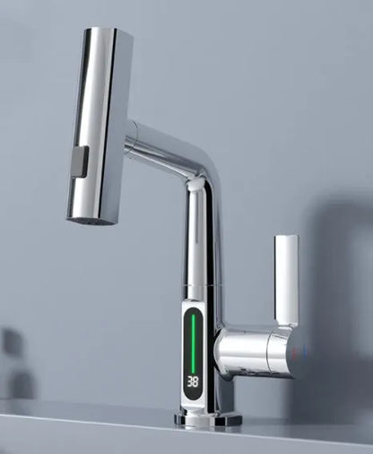 Modern digital display kitchen tap with pull-out spray hose showing LED temperature screen.