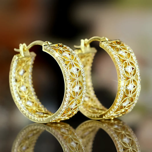 Golden copper ear clip jewellery featuring a geometric horse eye design with flower and butterfly details.
