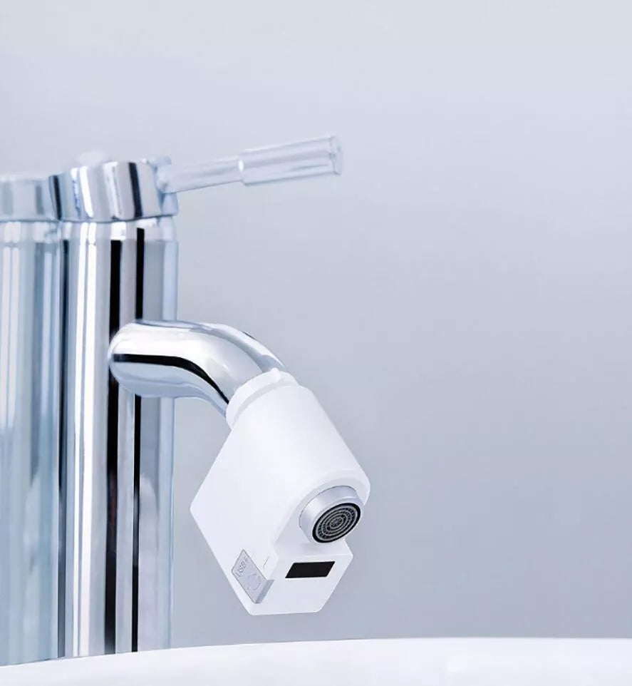 Infrared induction water saving device for faucets with USB charging