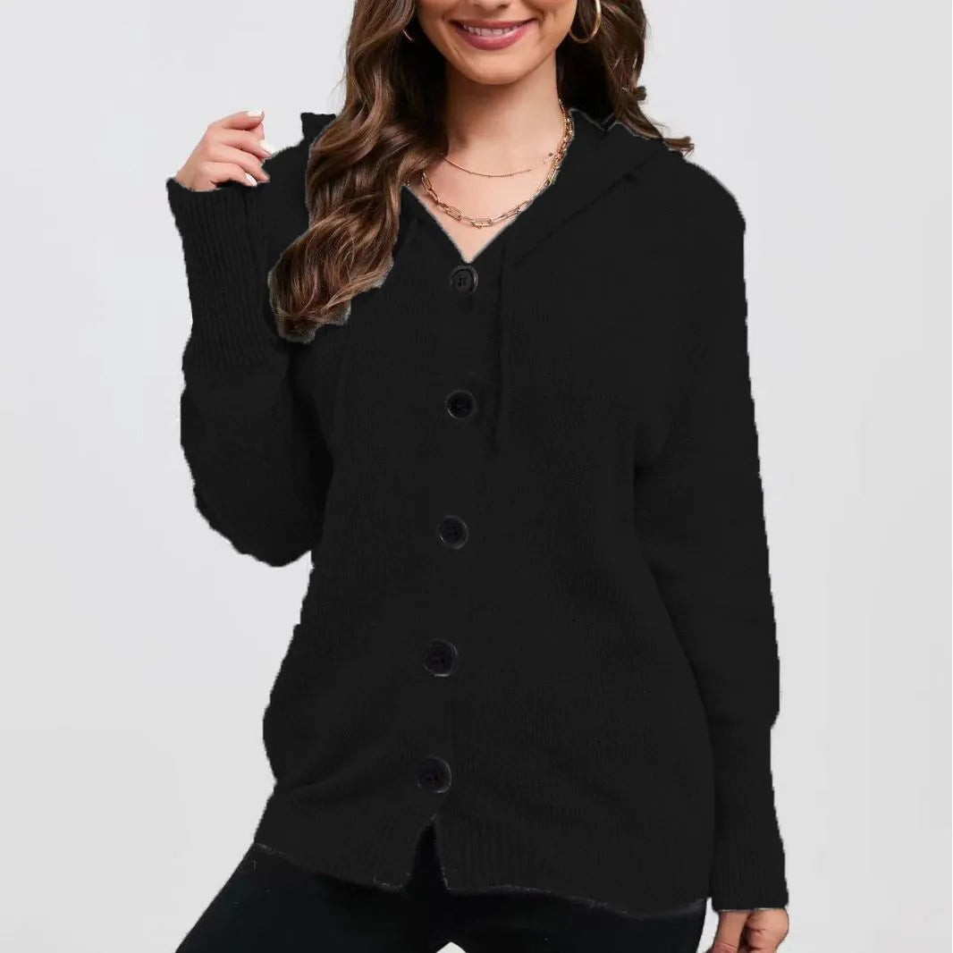 A woman wearing a loose, thick, hooded cotton cardigan in a solid colour.
