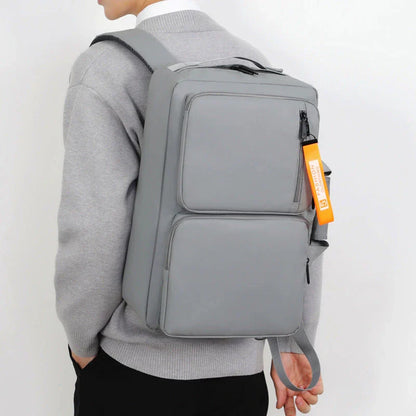 Versatile business laptop backpack with large capacity, USB charging port, and stylish design in gray and black colors