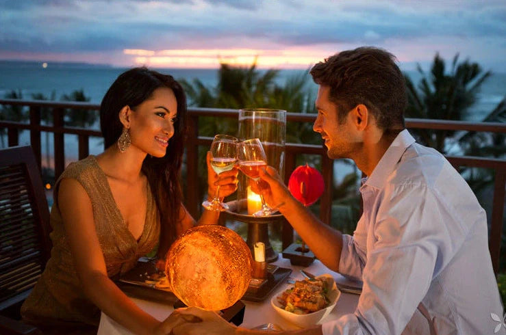 3D printed moon lamp with detailed crater surface on wooden base showing LED illumination
