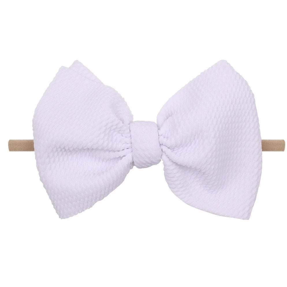 Children's waffle fabric bow hair accessory headband in multiple colour options