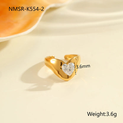 Geometric zircon ring showing round, oval and quadrangular design elements in stainless steel with electroplated finish