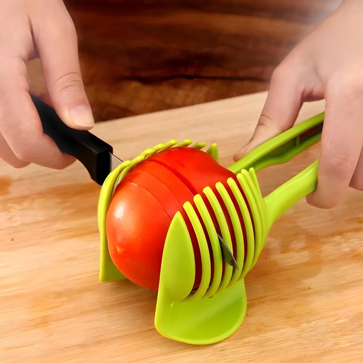 Plastic fruit and vegetable cutting holder slicer in black or green, measuring 18.5cm by 8cm